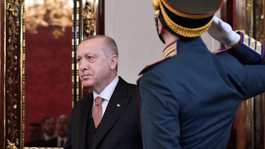 Turkish President Tayyip Erdogan walks past a guard of honour as he attends a meeting with his Russian counterpart Vladimir Putin at the Kremlin in Moscow, Russia April 8, 2019. Sputnik/Alexei Nikolsky/Kremlin via REUTERS  ATTENTION EDITORS - THIS IMAGE WAS PROVIDED BY A THIRD PARTY. - RC139E354840