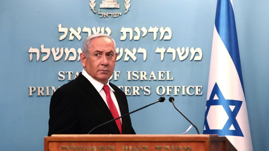 Israeli Prime Minister Benjamin Netanyahu delivers a speech at his Jerusalem office, regarding the new measures that will be taken to fight the coronavirus, March 14, 2020. Gali Tibbon/Pool via REUTERS - RC2WJF9FHOZY