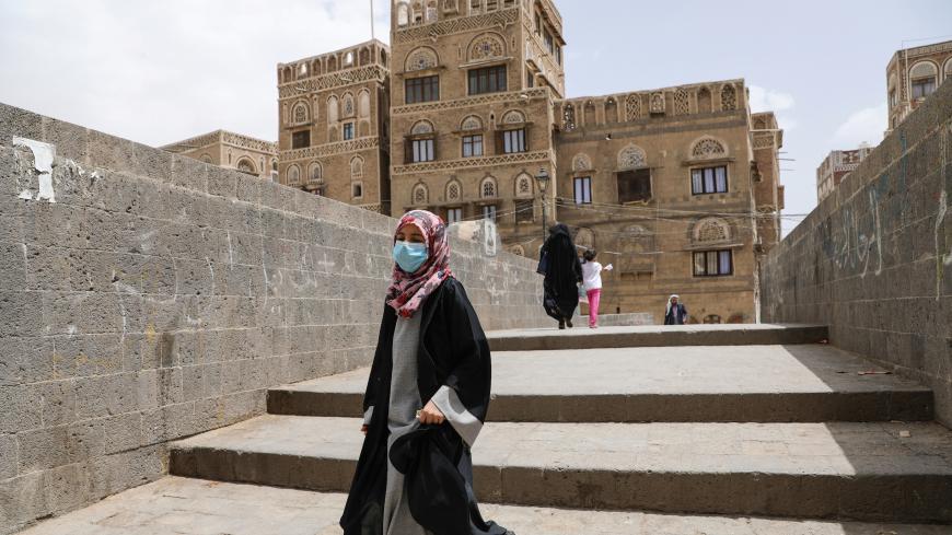 A girl wears a protective face mask amid fears of the spread of the coronavirus disease (COVID-19) in Sanaa, Yemen March 17, 2020. REUTERS/Khaled Abdullah - RC2GMF9MKBUS