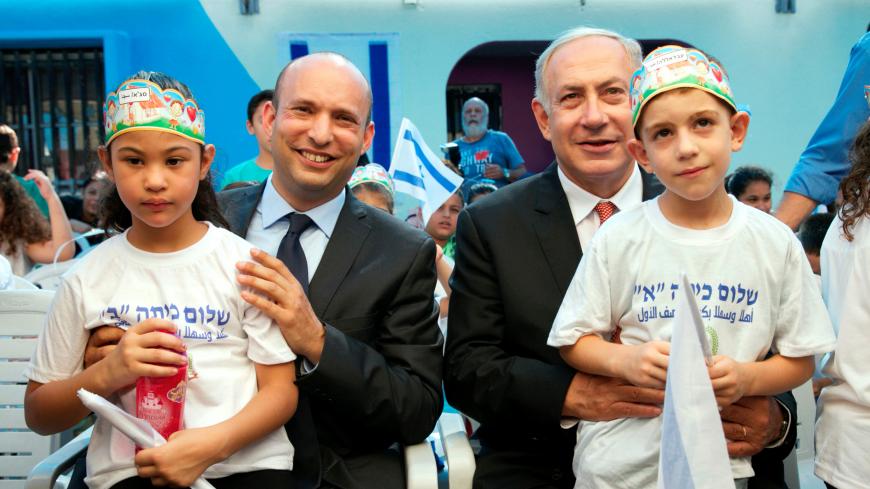 Israeli Prime Minister Benjamin Netanyahu (R) and Education Minister Naftali Bennett with pupils during a visit at the "Tamra HaEmek" elementary school on the first day of the school year, in the Arab Israeli town of Tamra, Israel September 1, 2016. REUTERS/Baz Ratner - S1AETYTKZEAA