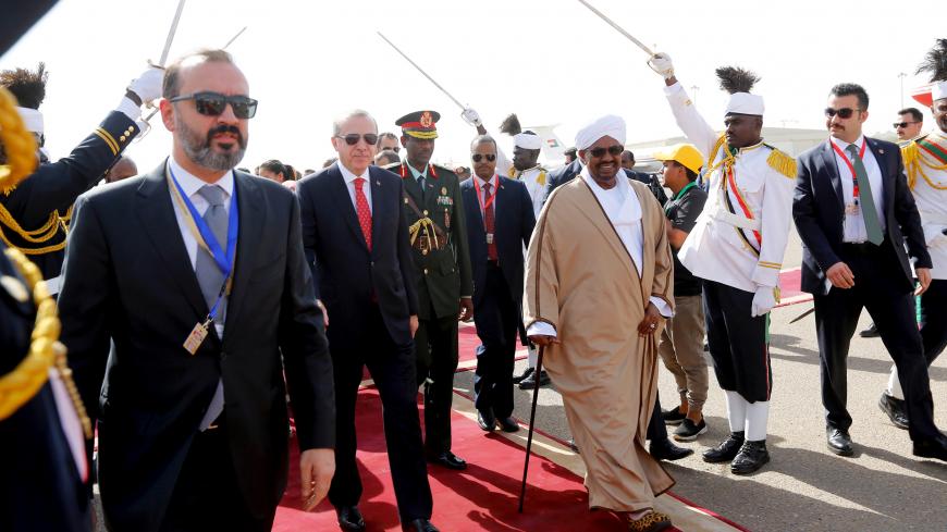 Sudan’s President Omer Al Bashir welcomes Turkey's President Recep Tayyip Erdogan at Khartoum Airport, Sudan December 24, 2017. REUTERS/Mohamed Nureldin Abdallah - RC1EBBF69470
