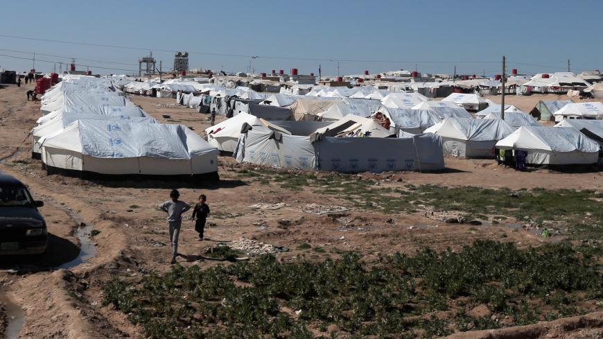 Boys walk at al-Hol displacement camp in Hasaka governorate, Syria March 8, 2019. REUTERS/Issam Abdallah - RC1FE9B01970