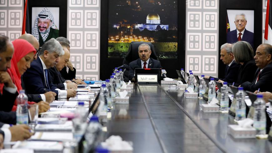Palestinian Prime Minister Mohammad Shtayyeh speaks during a cabinet meeting of the new Palestinian government, in Ramallah, in the Israeli-occupied West Bank April 15, 2019. REUTERS/Mohamad Torokman - RC18BBEC7170
