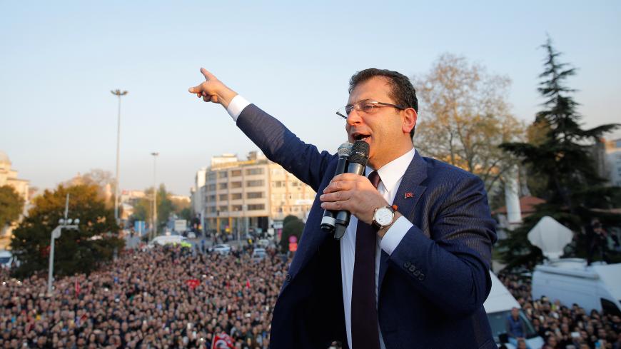 Newly elected Mayor of Istanbul Ekrem Imamoglu of the main opposition Republican People's Party (CHP) addresses his supporters after taking the office in Istanbul, Turkey, April 17, 2019. REUTERS/Huseyin Aldemir - RC125A53B110