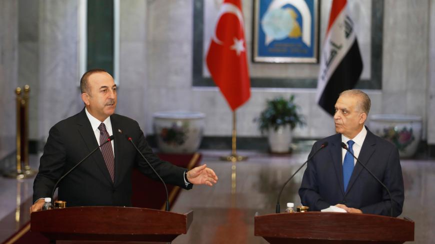 Turkish Foreign Minister Mevlut Cavusoglu speaks during a news conference with Iraqi Foreign Minister Mohamed Ali Alhakim in Baghdad, Iraq April 28, 2019. REUTERS/Khalid Al-Mousily - RC1AE7284290
