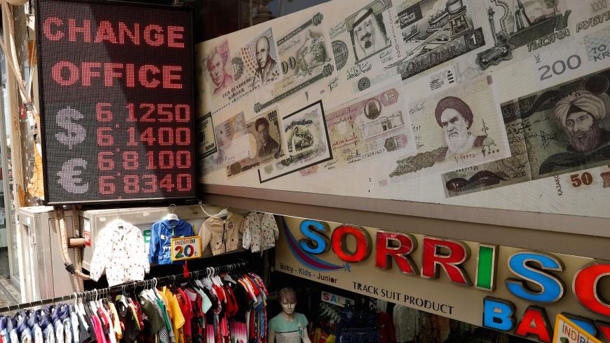 A board showing the currency exchange rates of the U.S. dollar and the Euro against Turkish lira is seen outside a currency exchange office in Istanbul, Turkey, May 23, 2019. REUTERS/Murad Sezer - RC1A6073F020