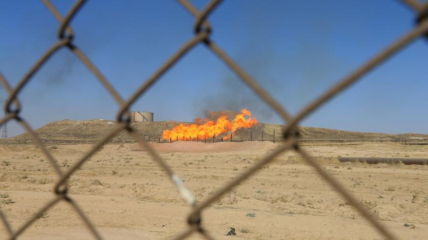 Flames emerge from flare stacks at the oil fields in Kirkuk, Iraq October 18, 2017. REUTERS/Alaa Al-Marjani - RC15269F5E00