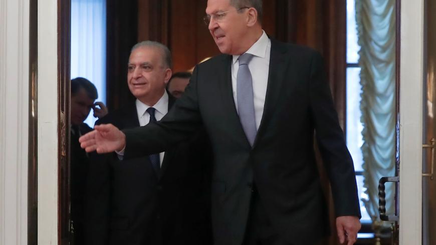 Russian Foreign Minister Sergei Lavrov (R) and his Iraqi counterpart Mohammed al-Hakim enter a hall during a meeting in Moscow, Russia January 30, 2019. REUTERS/Maxim Shemetov - RC147B91D090
