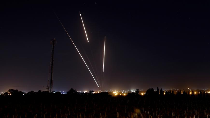 Streaks of light are pictured as rockets are launched from the  Gaza Strip towards Israel, as seen from the Israeli side of the border March 25, 2019 REUTERS/Amir Cohen - RC1BAFEB0A50