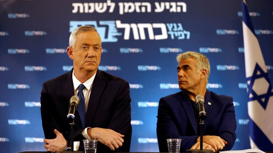 Benny Gantz and Yair Lapid, leaders of Blue and White party, sit during a news conference in Tel Aviv, Israel April 1, 2019. REUTERS/Corinna Kern - RC1BFEF7E3E0