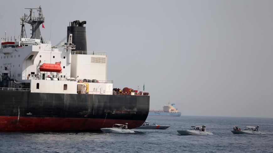 UAE Navy boats are seen next to Al Marzoqah, Saudi Arabian tanker, off the Port of Fujairah, UAE May 13, 2019.REUTERS/Satish Kumar - RC1AA0D0CE30