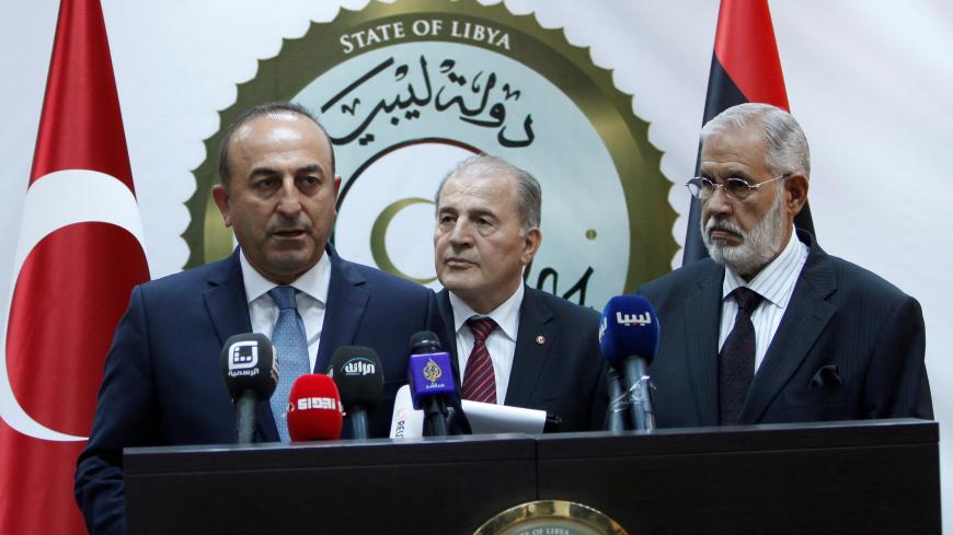 Turkey's Foreign Minister Mevlut Cavusoglu (L) speaks during a joint news conference with Mohammed Siyala (R), foreign minister in Libya's new U.N.-backed national unity government, in Tripoli, Libya, May 30, 2016. REUTERS/Ismail Zitouny - S1BETHAIQPAA