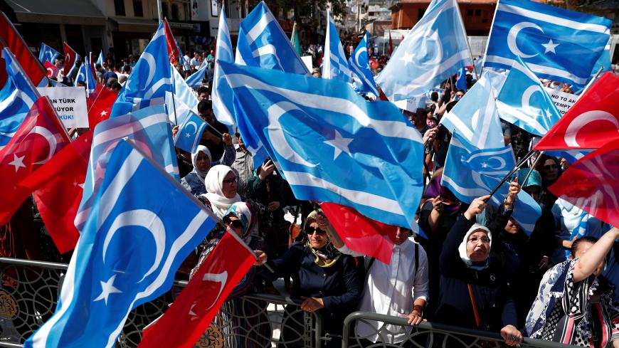 Demonstrators wave Turkish and Iraqi Turkmen (blue) flags during a protest against the independence referendum in northern Iraq, in Istanbul, Turkey, September 17, 2017. REUTERS/Murad Sezer - RC1F65EFDC90
