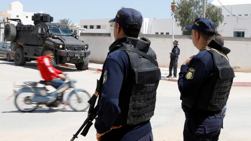Police officers stand guard in the town of Ben Guerdane, near the Libyan border, Tunisia April 16, 2019. Picture taken April 16, 2019. REUTERS/Zoubeir Souissi - RC11D6AA6E60