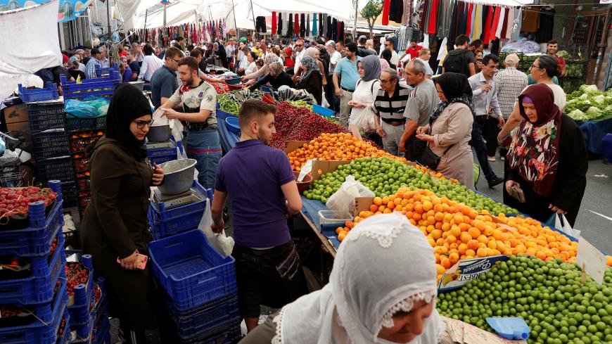People shop at a bazaar in Istanbul, Turkey, May 29, 2019. REUTERS/Murad Sezer - RC1956071CA0