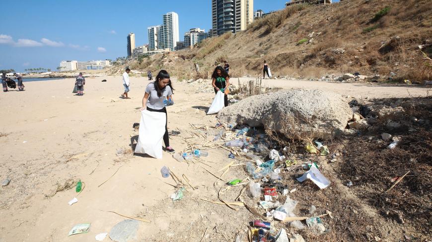 Volunteers take part in cleaning a public beach in the Lebanese capital Beirut's Ramlet al-Baida neighbourhood on September 15, 2018, during International Coastal Clean-Up Day. (Photo by ANWAR AMRO / AFP)        (Photo credit should read ANWAR AMRO/AFP/Getty Images)