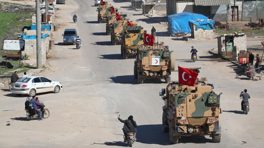 A column of armoured Turkish military vehicles drives on a patrol along a road in the de-militarised zone in Syria's northern Idlib province near the town Saraqib on March 8, 2019. - In September 2018, Syrian rebel backer Turkey and regime ally Russia inked a deal to set up a buffer zone in northern Syria. Russia halted an imminent regime offensive many feared could lead to the Syrian conflict's worst bloodbath yet, in exchange for which Turkey was to remove jihadists from the edges of the region. (Photo by