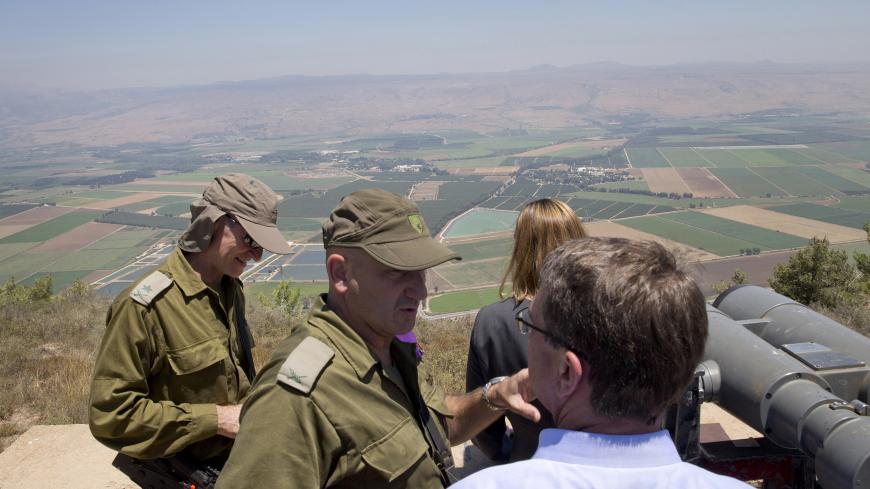 KIRYAT SHMONA, ISRAEL - JULY 20:  U.S. Defense Secretary Ash Carter, lower right, talks with Israel Defense Forces (IDF) 91st Division Commander Moni Katz, center as Deputy Chief of Staff Maj. Gen. Yair Golan stands left, as they view the Hula Valley from the Hussein Lookout in northern Israel along the boarder with Lebanon July 20, 2015 near Kiryat Shmona, Israel. Carter said he has no expectation of persuading Israeli leaders to drop their opposition to the Iran nuclear deal, but will instead emphasize th