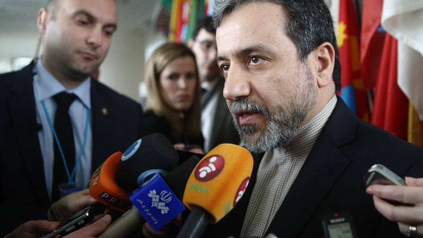 Iran's chief nuclear negotiator Abbas Araghchi talks to the media after meeting IAEA Director General Yukiya Amano (not pictured) at the IAEA headquarters in Vienna February 24, 2015. REUTERS/Heinz-Peter Bader  (AUSTRIA) - LR2EB2O0U2LF6