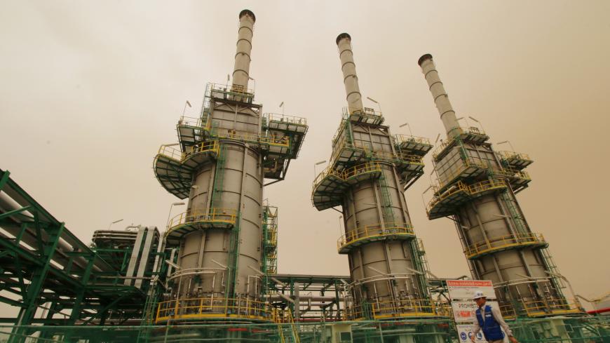 A worker walks at the Zubair oilfield in Basra, Iraq May 9, 2018. REUTERS/Essam al-Sudani - RC15616A6B70