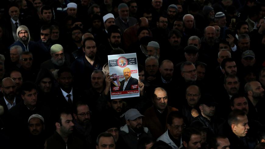 People attend a symbolic funeral prayer for Saudi journalist Jamal Khashoggi at the courtyard of Fatih mosque in Istanbul, Turkey November 16, 2018. REUTERS/Huseyin Aldemir     TPX IMAGES OF THE DAY - RC132008EDA0
