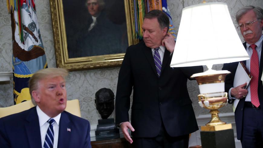 U.S. President Donald Trump speaks during a meeting with Canada's Prime Minister Justin Trudeau as Secretary of State Mike Pompeo and White House national security adviser John Bolton look on in the Oval Office of the White House in Washington, U.S., June 20, 2019. REUTERS/Jonathan Ernst - RC1B875D0060