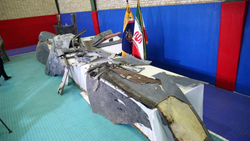 REFILE - UPDATING BYLINE The purported wreckage of the American drone is seen displayed by the Islamic Revolution Guards Corps (IRGC) in Tehran, Iran June 21, 2019. Meghdad Madadi/Tasnim News Agency/Handout via REUTERS ATTENTION EDITORS - THIS IMAGE WAS PROVIDED BY A THIRD PARTY. - RC1CF0139CF0
