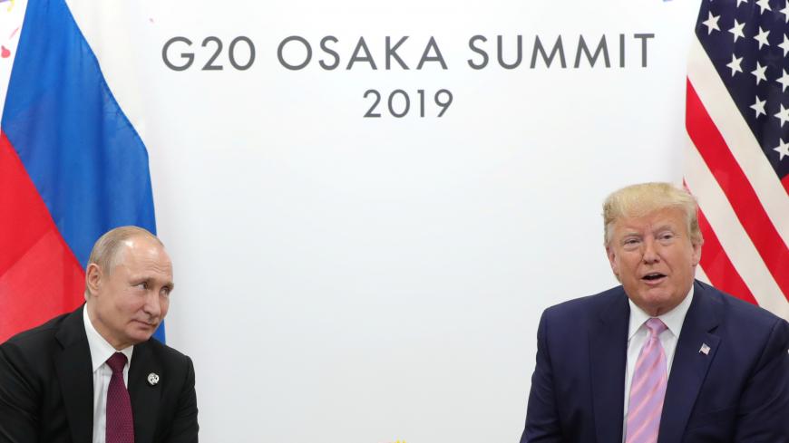 Russia's President Vladimir Putin and U.S. President Donald Trump attend a meeting on the sidelines of the G20 summit in Osaka, Japan June 28, 2019. Sputnik/Mikhail Klimentyev/Kremlin via REUTERS  ATTENTION EDITORS - THIS IMAGE WAS PROVIDED BY A THIRD PARTY. - RC148D85F430