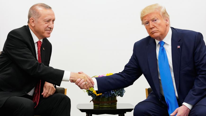 U.S. President Donald Trump shakes hands during a bilateral meeting with Turkey's President Tayyip Erdogan during the G20 leaders summit in Osaka, Japan, June 29, 2019. REUTERS/Kevin Lamarque - RC1A03B4EBE0