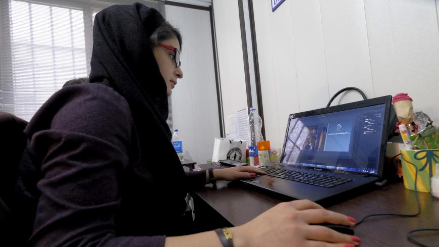 An employee works with her laptop at Takhfifan company in Tehran, Iran January 19, 2016. REUTERS/Raheb Homavandi/TIMA  ATTENTION EDITORS - THIS IMAGE WAS PROVIDED BY A THIRD PARTY. FOR EDITORIAL USE ONLY.   - GF20000100032