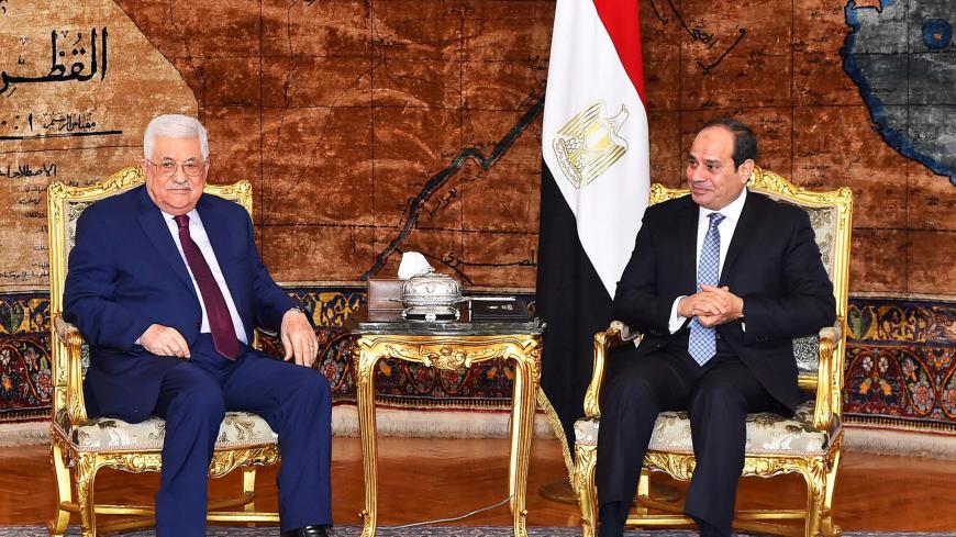 REFILE - ADDING INFORMATION Egyptian President Abdel-Fattah al-Sisi (R) meets with visiting Palestinian President Mahmoud Abbas in Cairo, Egypt December 11, 2017, in this handout picture courtesy of the Egyptian Presidency. Picture taken December 11, 2017. The Egyptian Presidency/Handout via REUTERS ATTENTION EDITORS - THIS IMAGE WAS PROVIDED BY A THIRD PARTY - RC14830EDA80