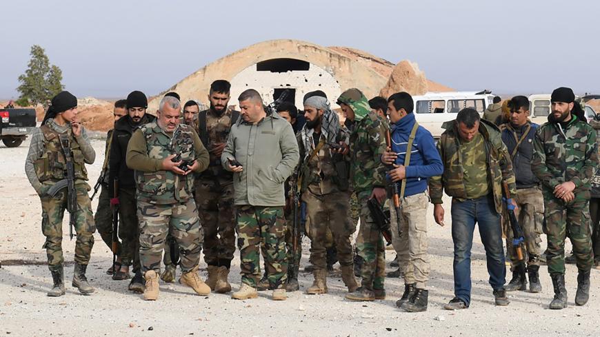 Syrian Army soldiers loyal to Syria's President Bashar al-Assad forces are seen in Idlib, Syria January 21, 2018. Picture taken January 21, 2018. SANA/Handout via REUTERS ATTENTION EDITORS - THIS PICTURE WAS PROVIDED BY A THIRD PARTY. REUTERS IS UNABLE TO INDEPENDENTLY VERIFY THE AUTHENTICITY, CONTENT, LOCATION OR DATE OF THIS IMAGE. - RC1DEF904AD0