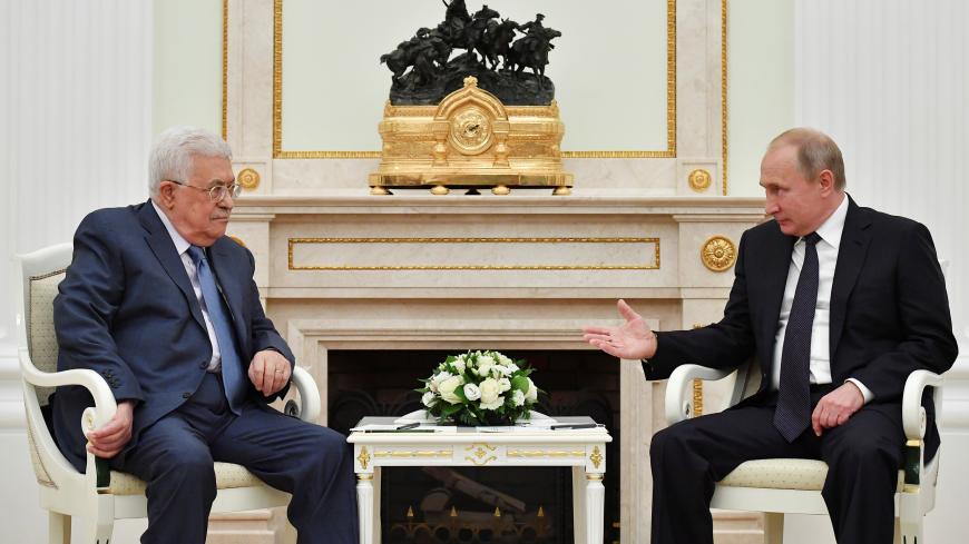 Russian President Vladimir Putin (R) meets with Palestinian President Mahmoud Abbas at the Kremlin in Moscow, Russia July 14, 2018. Pool/Yuri Kadobnov via REUTERS - RC140E5CC0F0