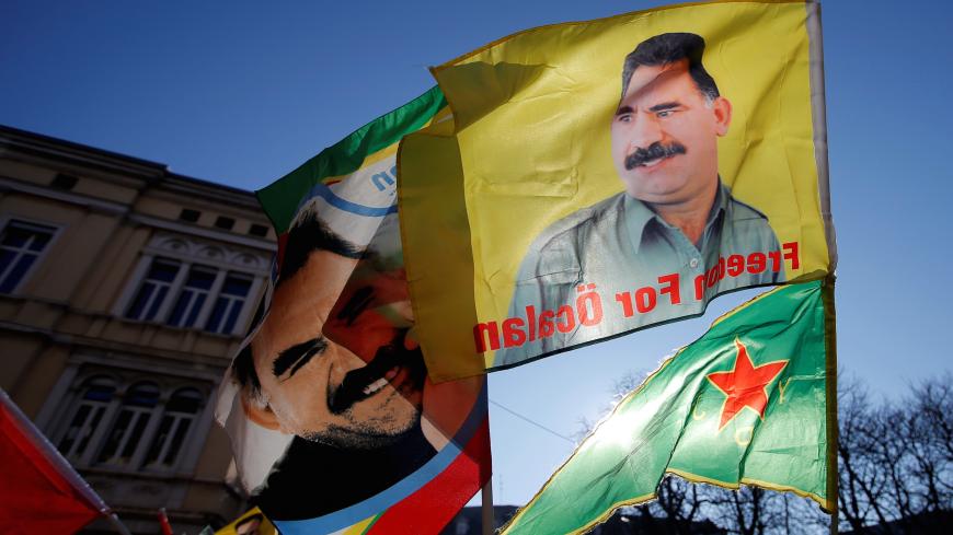 Pro-Kurd protesters hold flags with portraits of jailed Kurdistan Workers Party (PKK) leader Abdullah Ocalan as they take part in a demonstration in support to him in Strasbourg, France, February 16, 2019. REUTERS/Vincent Kessler - RC12D7661100