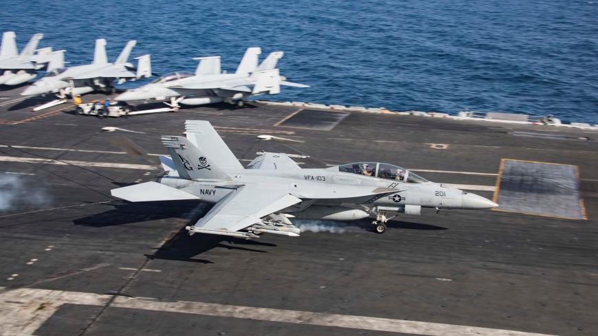 An F/A-18F Super Hornet makes an arrested landing on the flight deck of the U.S. Navy Nimitz-class aircraft carrier USS Abraham Lincoln in the Gulf of Oman May 22, 2019. Picture taken May 22, 2019. U.S. Navy/Mass Communication Specialist 2nd Class Matt Herbst/Handout via REUTERS. ATTENTION EDITORS - THIS IMAGE WAS PROVIDED BY A THIRD PARTY - RC1CD6851E40