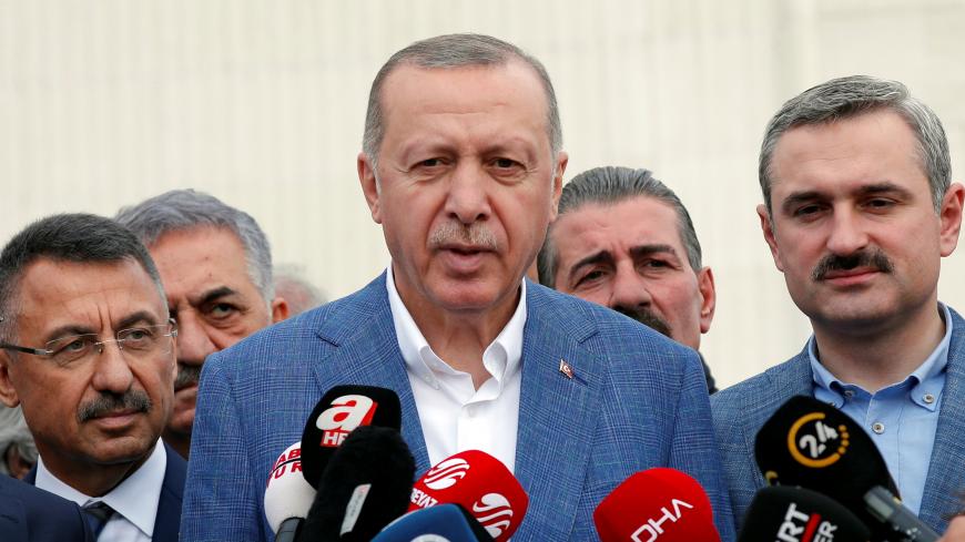 Turkish President Tayyip Erdogan talks to media after the Eid al-Fitr prayers to mark the end of the holy month of Ramadan in Istanbul, Turkey, June 4, 2019. REUTERS/Murad Sezer - RC13F54A8DE0