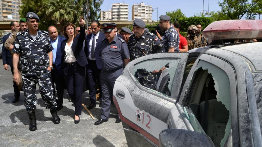 Lebanon's Interior Minister Raya al-Hassan visits the scene where a militant attacked a security forces patrol on Monday night, in Lebanon's northern city of Tripoli, Lebanon June 4, 2019. REUTERS/Omar Ibrahim - RC116C8C99B0