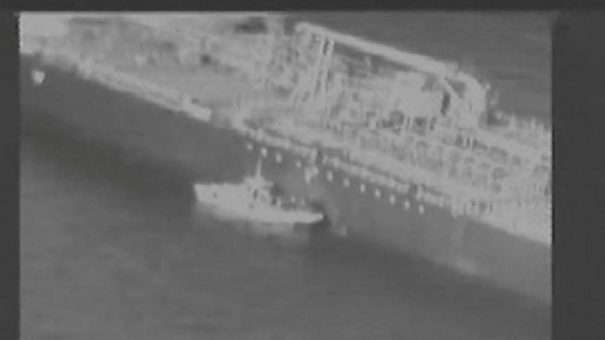 Still image taken from a U.S. military handout video purports to show Iran's Revolutionary Guard (IRGC) removing an unexploded limpet mine from the side of the Kokuka Courageous Tanker, June 13, 2019. Courtesy U.S. Military/Handout via REUTERS ATTENTION EDITORS - THIS IMAGE HAS BEEN SUPPLIED BY A THIRD PARTY. - RC1520E6C0B0