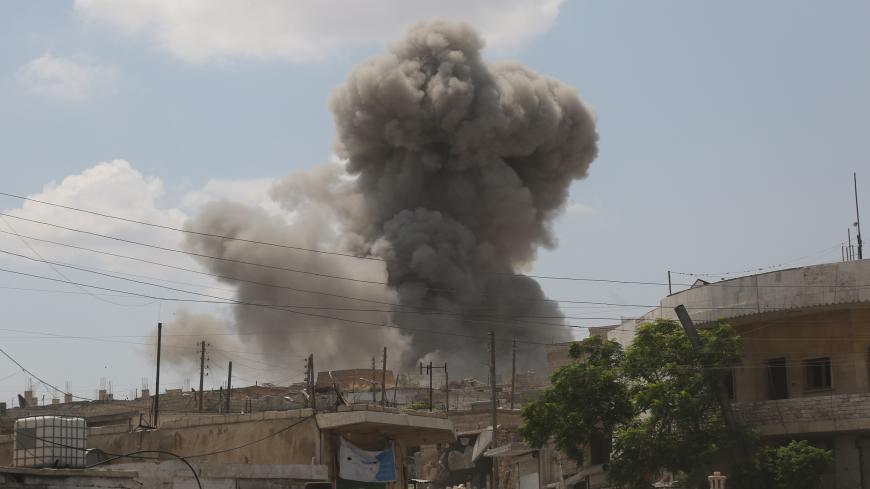 IDLIB, SYRIA - JULY 16 : Smoke rises after airstrikes by Assad Regime hit the de-escalation zone of Maar Shurin village in Idlib, Syria on July 16, 2019. At least 9 civilians were killed and 14 injured.  (Photo by Izeddin Idilbi/Anadolu Agency/Getty Images)