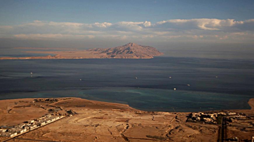 (FILE) A picture taken on January 14, 2014 through the window of an airplane shows the Red Sea's Tiran (foreground) and the Sanafir (background) islands in the Strait of Tiran between Egypt's Sinai Peninsula and Saudi Arabia.
Saudi King Salman on April 11, 2016 wrapped up a landmark five-day visit to Egypt marked by lavish praise and multi-billion-dollar investment deals, in a clear sign of support for President Abdel Fattah al-Sisi's regime. Egypt also agreed during the visit to demarcate its maritime bord