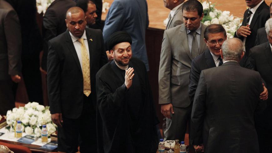 Ammar al-Hakim (C), leader of the Islamic Supreme Council of Iraq (ISCI), attends a parliament session at the parliament headquarters in Baghdad September 8, 2014. Iraq's parliament approved a new government headed by Haider al-Abadi as prime minister on Monday night, in a bid to rescue Iraq from collapse, with sectarianism and Arab-Kurdish tensions on the rise.    REUTERS/Ahmed Saad (IRAQ - Tags - Tags: POLITICS ELECTIONS RELIGION) - GM1EA990L3001