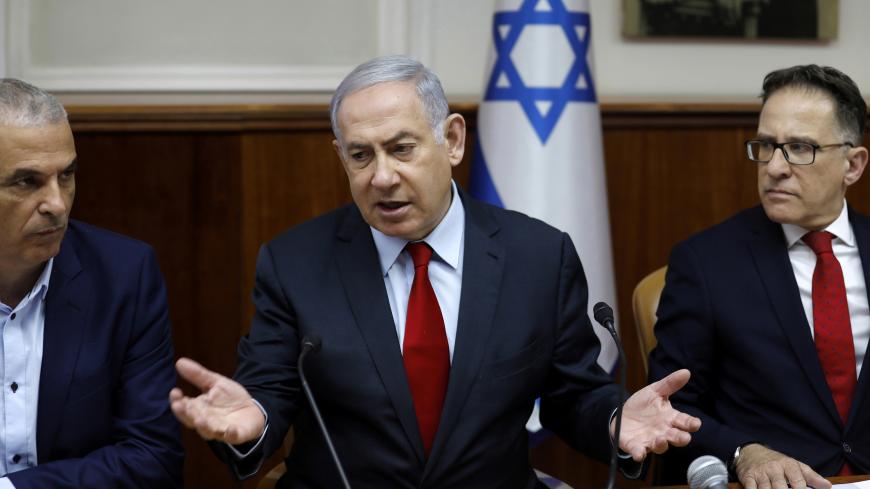 Israeli Prime Minister Benjamin Netanyahu, Cabinet Secretary Tzachi Braverman and Finance Minister Moshe Kahlon attend a weekly cabinet meeting in Jerusalem June 24, 2019. Menahem Kahana/Pool via REUTERS - RC17FDAEC320
