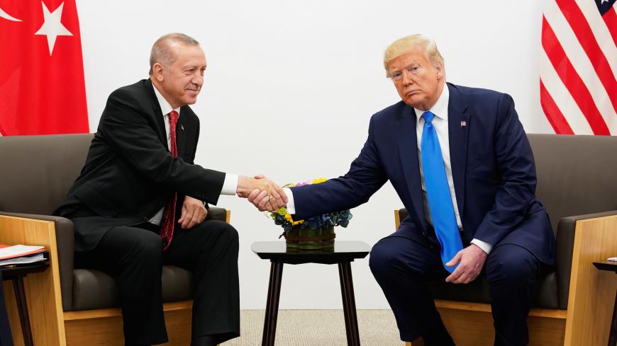 U.S. President Donald Trump shakes hands during a bilateral meeting with Turkey's President Tayyip Erdogan during the G20 leaders summit in Osaka, Japan, June 29, 2019. REUTERS/Kevin Lamarque - RC1DDD25D480