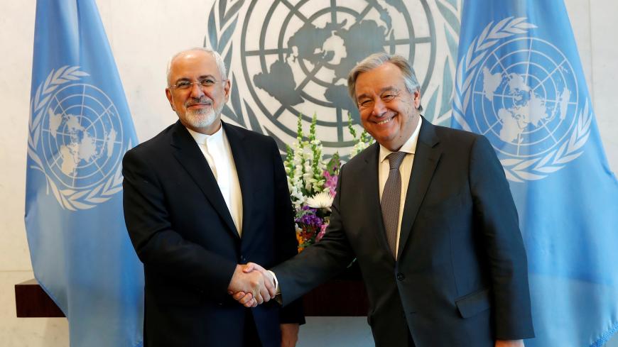 Iran's Foreign Minister Mohammad Javad Zarif (L) poses with United Nations Secretary General Antonio Guterres after the two attended a High-Level Meeting on Peacebuilding and Sustaining Peace at U.N. headquarters in New York City, New York, U.S., April 24, 2018. REUTERS/Mike Segar - RC1BAECA4150
