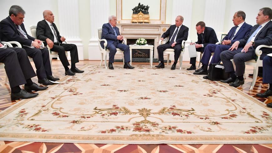 Members of the Russian delegation, led by President Vladimir Putin (4th R), meet with members of the Palestinian delegation, led by President Mahmoud Abbas (3rd L), at the Kremlin in Moscow, Russia July 14, 2018. Pool/Yuri Kadobnov via REUTERS - RC1186A1AE10