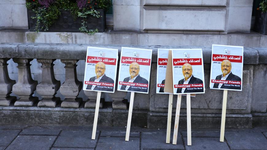 Placards can be seen outside the embassy as people protest against the killing of journalist Jamal Khashoggi in Turkey outside the Saudi Arabian Embassy in London, Britain, October 26 2018. REUTERS/Simon Dawson - RC1CC0BA7F80