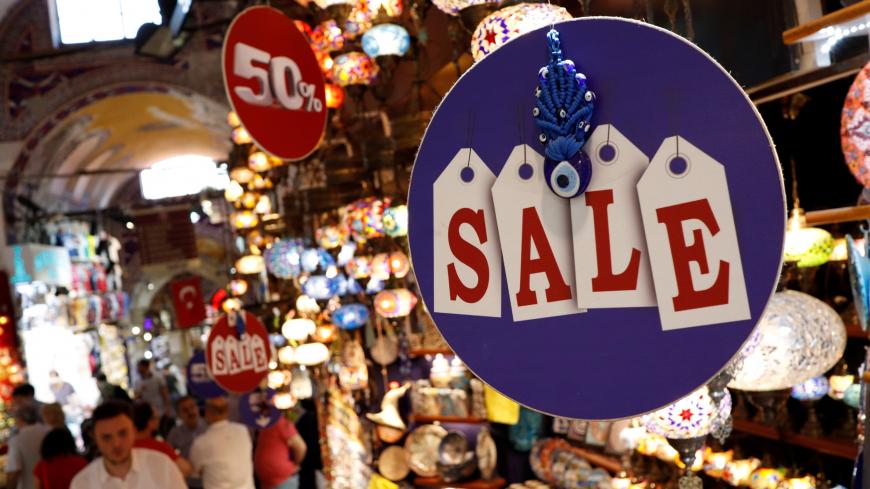 A discount sign is seen at a tourist shop at the historical Grand Bazaar, known as the Covered Bazaar, in Istanbul, Turkey, May 23, 2019. REUTERS/Murad Sezer - RC178DDDAD80