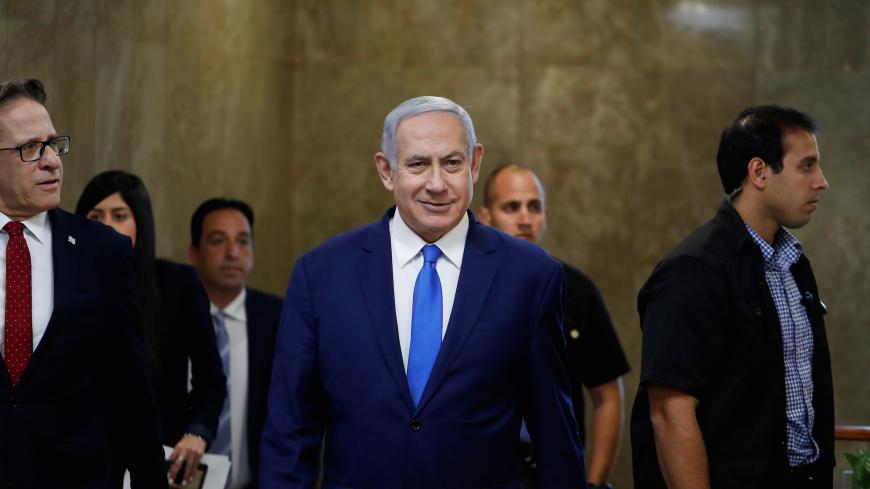 Israeli Prime Minister Benjamin Netanyahu arrives to the weekly cabinet meeting in Jerusalem July 14, 2019. REUTERS/Ronen Zvulun - RC1FC20FC200