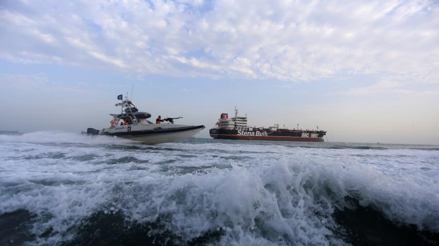 A boat of the Iranian Revolutionary Guard sails close to Stena Impero, a British-flagged vessel owned by Stena Bulk, near Bandar Abbas port, Iran July 21, 2019. Picture taken July 21, 2019. Fars News Agency/ WANA Handout via REUTERS ATTENTION EDITORS - THIS IMAGE WAS PROVIDED BY A THIRD PARTY. - RC1D73A09A90