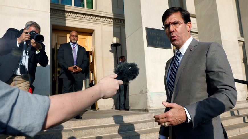 Mark Esper talks to reporters as he arrives for the first day on job as New U.S. Secretary of Defense at the Pentagon in Arlington, Virginia, U.S. July 24, 2019. REUTERS/Yuri Gripas - RC188D6C2000